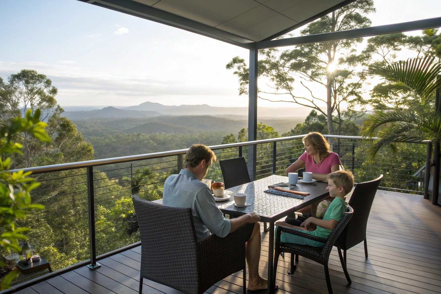 Family enjoying elevated outdoor living on custom balcony construction, Sunshine Coast
