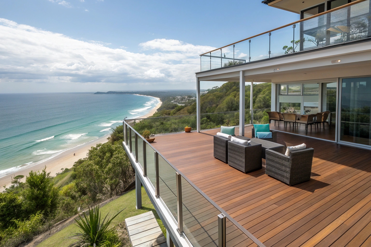 Elevated deck installation Sunshine Coast - Professional high-set home deck with ocean views and glass balustrades