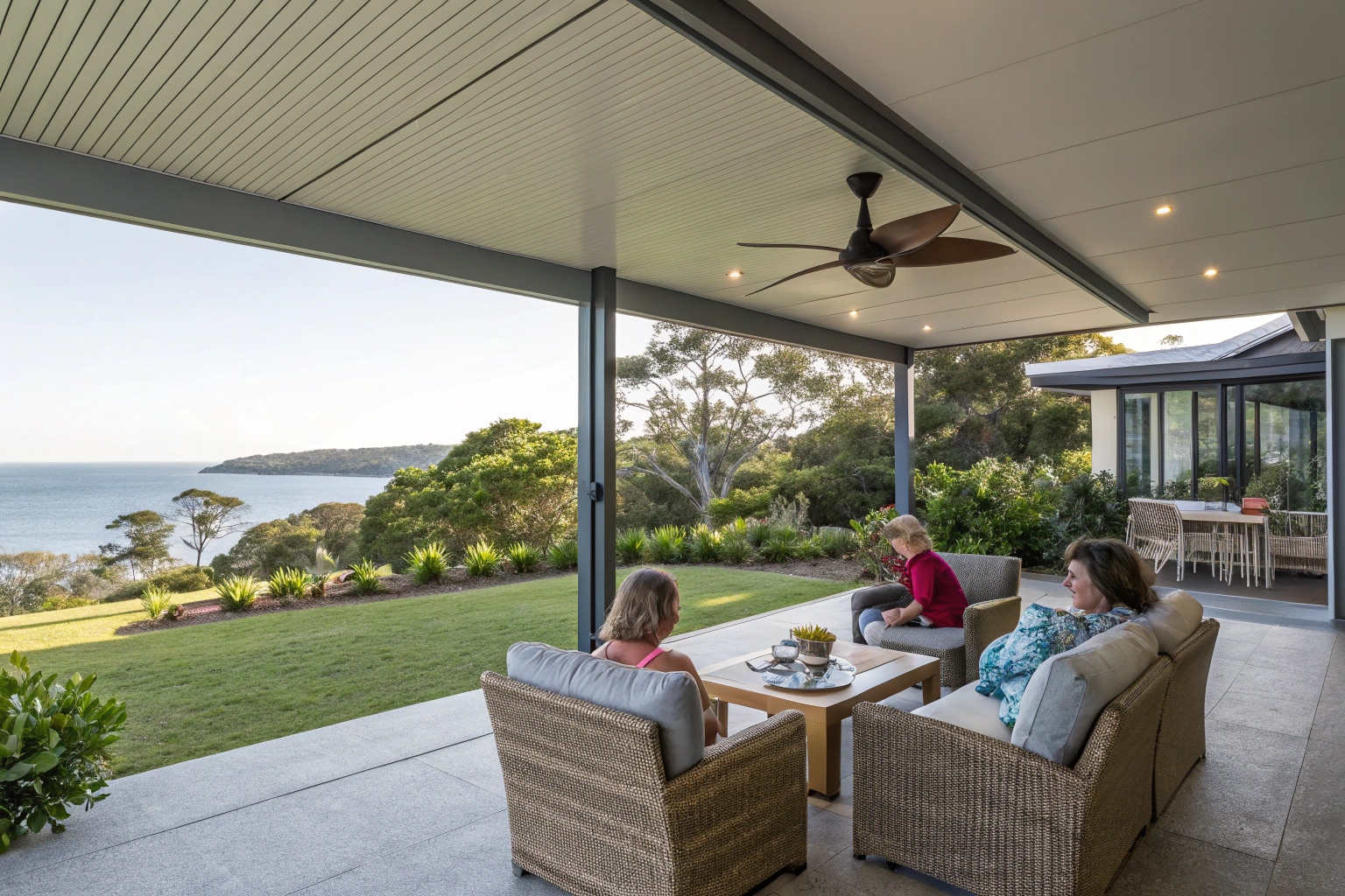 a-modern-covered-patio-with-comfortable-outdoor-fu Modern patio enclosure Sunshine Coast with family entertaining in covered outdoor living space