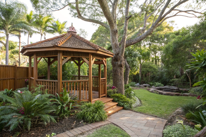 Custom hardwood timber gazebo in subtropical Sunshine Coast garden with mature landscaping
